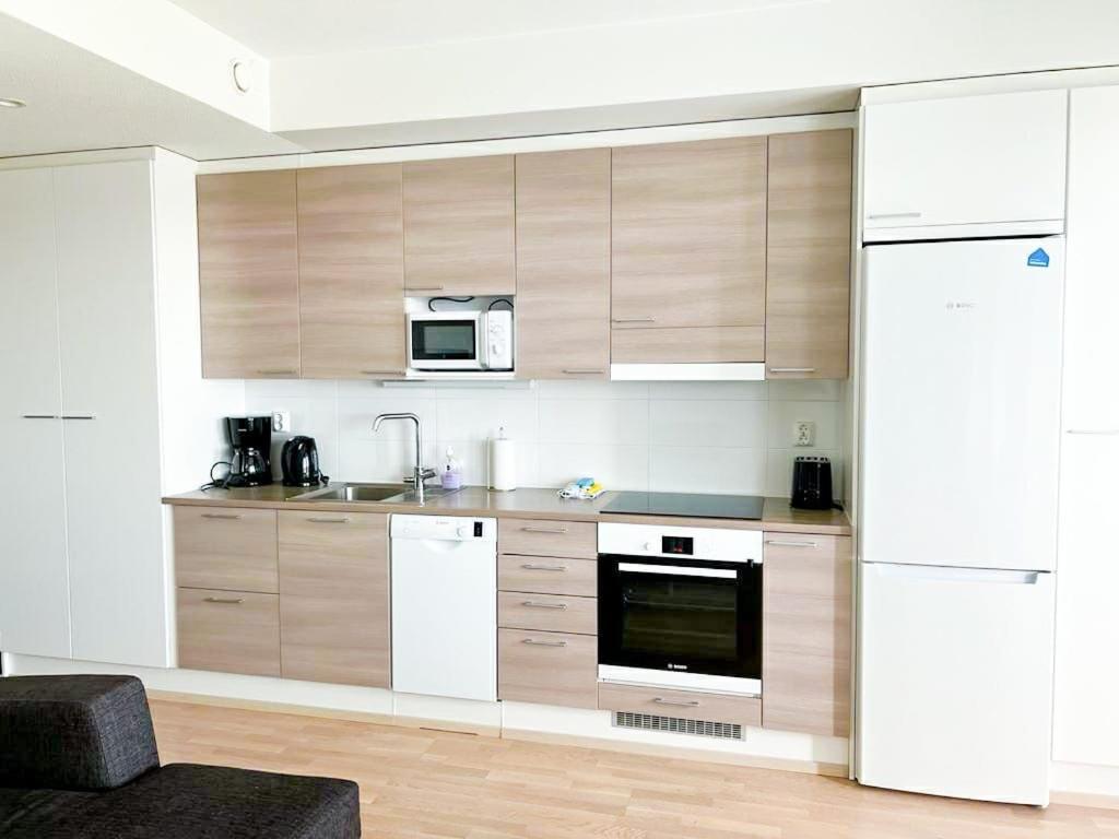 Kotimaailma Apartments เอาลู ภายนอก รูปภาพ